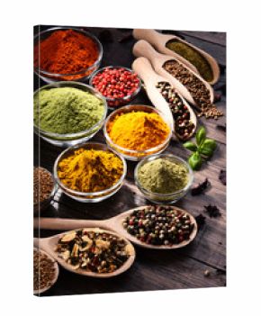 Variety of spices and herbs on kitchen table