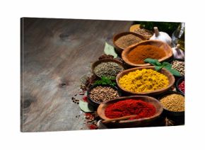 assortment of oriental spices on a wooden background