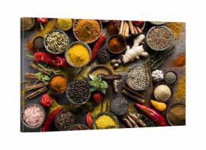 Spices and herbs in wooden bowls. Food and cuisine ingredients