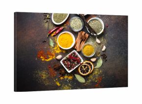 Set of Various spices on dark stone table.