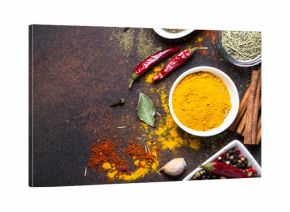 Set of Various spices on dark stone table.