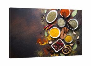 Set of Various spices on dark stone table. Top view. Food background.