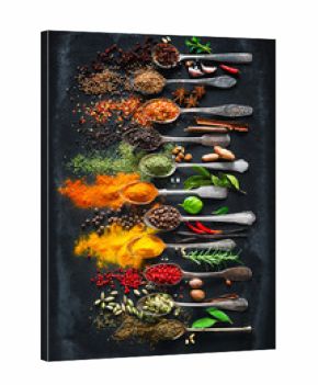 Herbs and spices for cooking on dark background