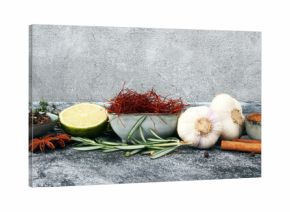 Spices and herbs on grey background. Food and cuisine ingredients.
