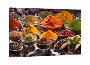 Variety of spices and herbs on kitchen table