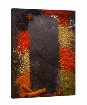 Different kind of spices on dark background.