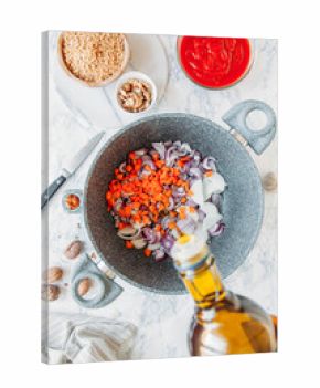 Preparing vegan bolognese with soy meat and walnuts