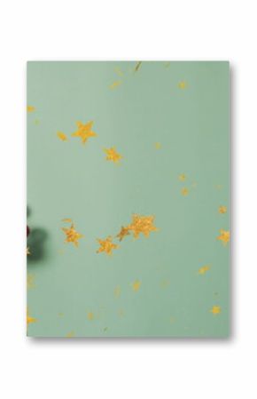 Featuring red berry sprigs on mint table, scattering snowflakes and gold star confetti, copy space