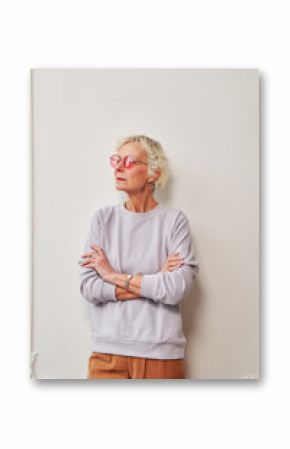 Side view of a happy senior woman on white.