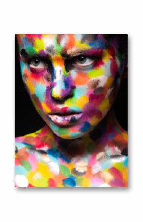 Girl with colored face painted. Art beauty image.