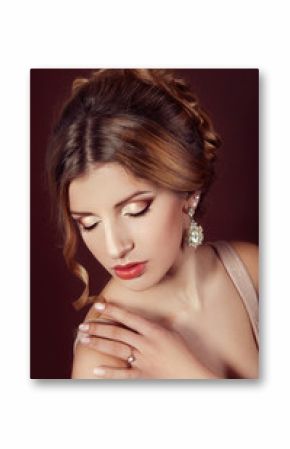 Studio portrait of a beautiful dark blond woman with evening hai