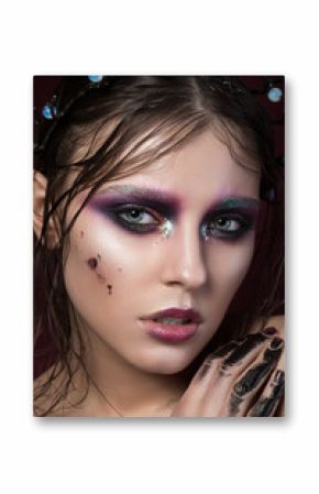 Beauty portrait of a young girl with fashion creative make-up