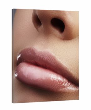 Close-up beautiful female lips with bright lipgloss makeup. Perfect clean skin, light fresh lip make-up. Beautiful spa macro shot with tender pink lip gloss. Spa and cosmetics