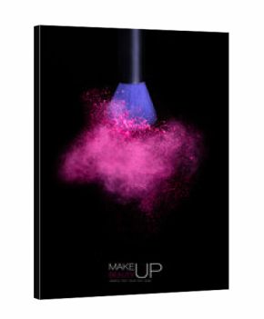 Makeup concept. Brush with powder explosion isolated on black