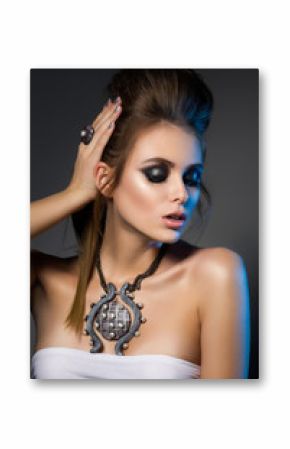 Beauty portrait of young glamorous woman touching her hair