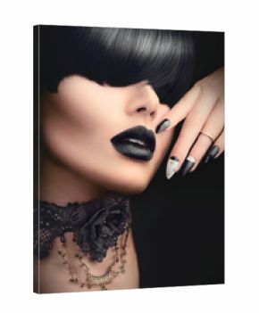 Fashion model girl with black gothic hairstyle, makeup, manicure and accessories