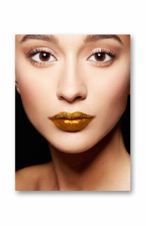 Closeup of beautiful woman face. Gold lip color, golden glitter upper lip and shiny lipgloss. Makeup and cosmetic image. 