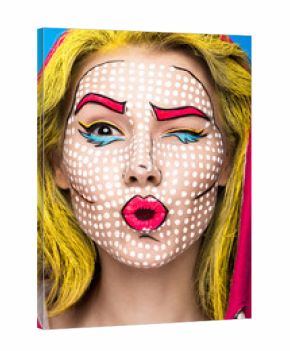 Photo of surprised young woman with professional comic pop art make-up and design manicure. Creative beauty style and nails. Photos shot in studio