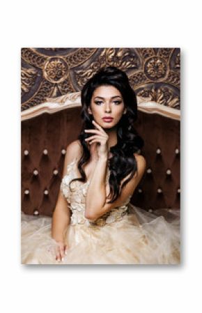 Luxury lady in a long dress posing in retro interior