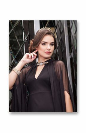 portrait of a beautiful young girl dressed in black on a backgro
