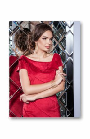 portrait of a beautiful young girl in a red dress on a backgroun
