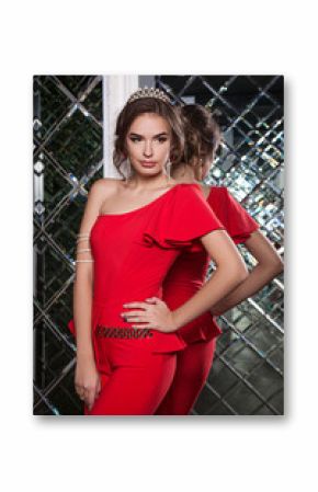 portrait of a beautiful young girl in a red dress on a backgroun