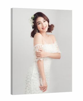 Beautiful asian woman bride on grey background