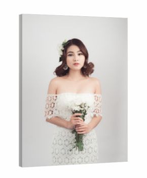 Beautiful asian woman bride on grey background