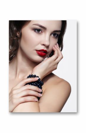 Portrait of young brunette woman on white background. Girl with necklace on the wrist