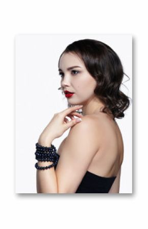Portrait of young brunette woman on white background. Girl with necklace on the wrist