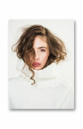 Makeup for model with soft skin. Beauty and hairdresser. Fashion look concept. Girl with makeup on pretty face. Trendy woman with stylish hair in white winter sweater. Perfect female