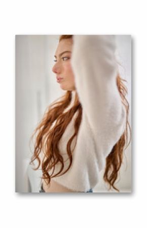 Girl making hairdo.