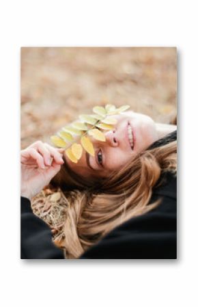 Happy young girl in the autumn forest