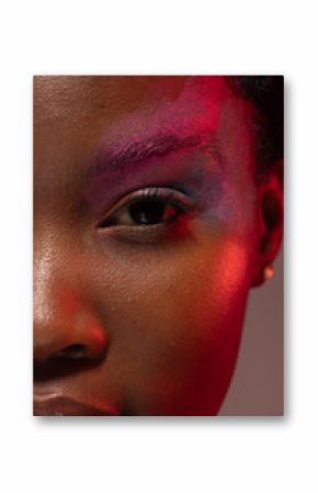 Half portrait of african american woman with short hair and colourful make up