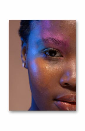 Half portrait of african american woman with short hair and colourful make up