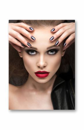 Beautiful girl in leather jacket with bright makeup and manicure "Cat's Eye". Beauty face. Nail Design. Picture taken in the studio on a black background.