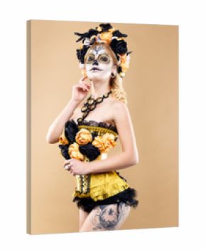 attractive young woman with sugar skull makeup,Dia de los Muertos - Mexican Day of the dead woman wearing sugar skull makeup and flower wreath.