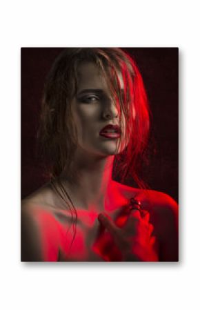 stunning woman in red half-light