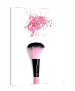 Close up of crushed blush on white background and cosmetic brush