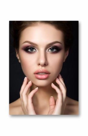 Portrait of young beautiful woman with evening make up