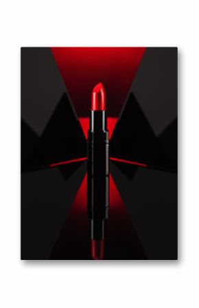 Red lipstick on black, reflective, mirror background. Background for cosmetic or beauty advertising.