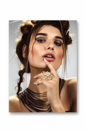 Beautiful fashion woman with creative make-up and hairstyle wearing glasses and jewelry. The beauty of the face. Photos shot in the studio.