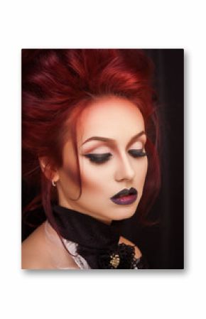 sexy woman with gothic makeup and red hair against old castle