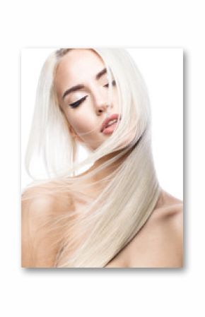 Beautiful blond girl in move with a perfectly smooth hair, and classic make-up. Beauty face. Picture taken in the studio.