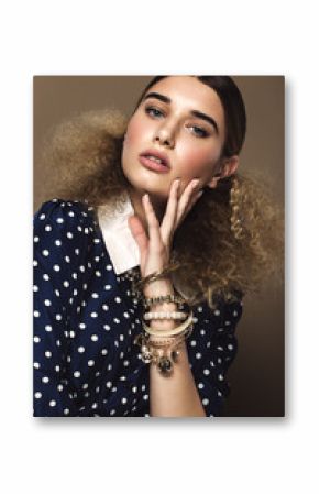 Beautiful girl with classic make-up and hairstyle art, clothing retro style. Beauty face. Photos shot in studio