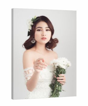 Beautiful asian woman bride on grey background