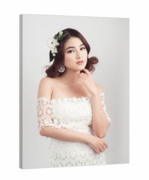 Beautiful asian woman bride on grey background