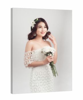 Beautiful asian woman bride on grey background
