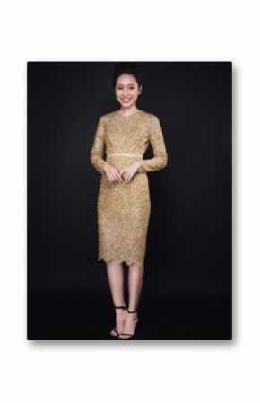 Full length portrait of happy attractive young woman posing cocktail dresses over black background