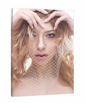 Young girl with make-up nude and white lace on face. A beautiful model with a gentle manicure and curls. Photo taken in the studio. Beauty of the face.